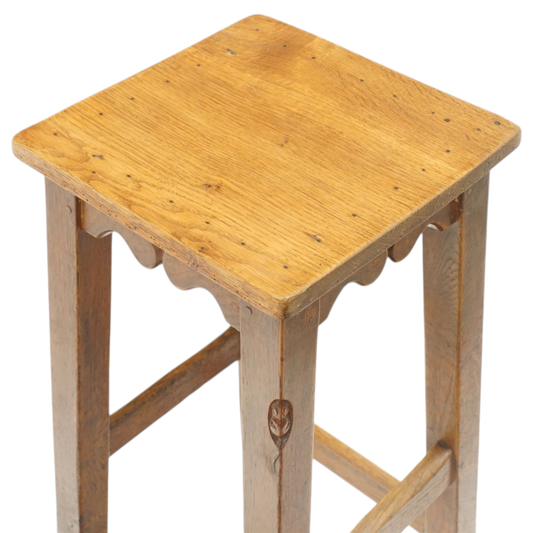Mouseman - circa 1940/50's oak bar stool, dished square top with shaped apron, raised on four tapering square legs, joined by rails, with carved mouse signature, by Robert Thompson of Kilburn, initialled with provenance from the Old Hall, Thornton-le-Dale, North Yorkshire, further info to follow