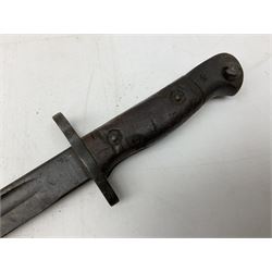 British Pattern 1907 bayonet with 43.5cm fullered steel blade; in leather scabbard with webbing frog L58cm overall; another Pattern 1907 bayonet lacking scabbard; and British Pattern 1888 Mk.I bayonet by Wilkinson London (no scabbard) (3)
