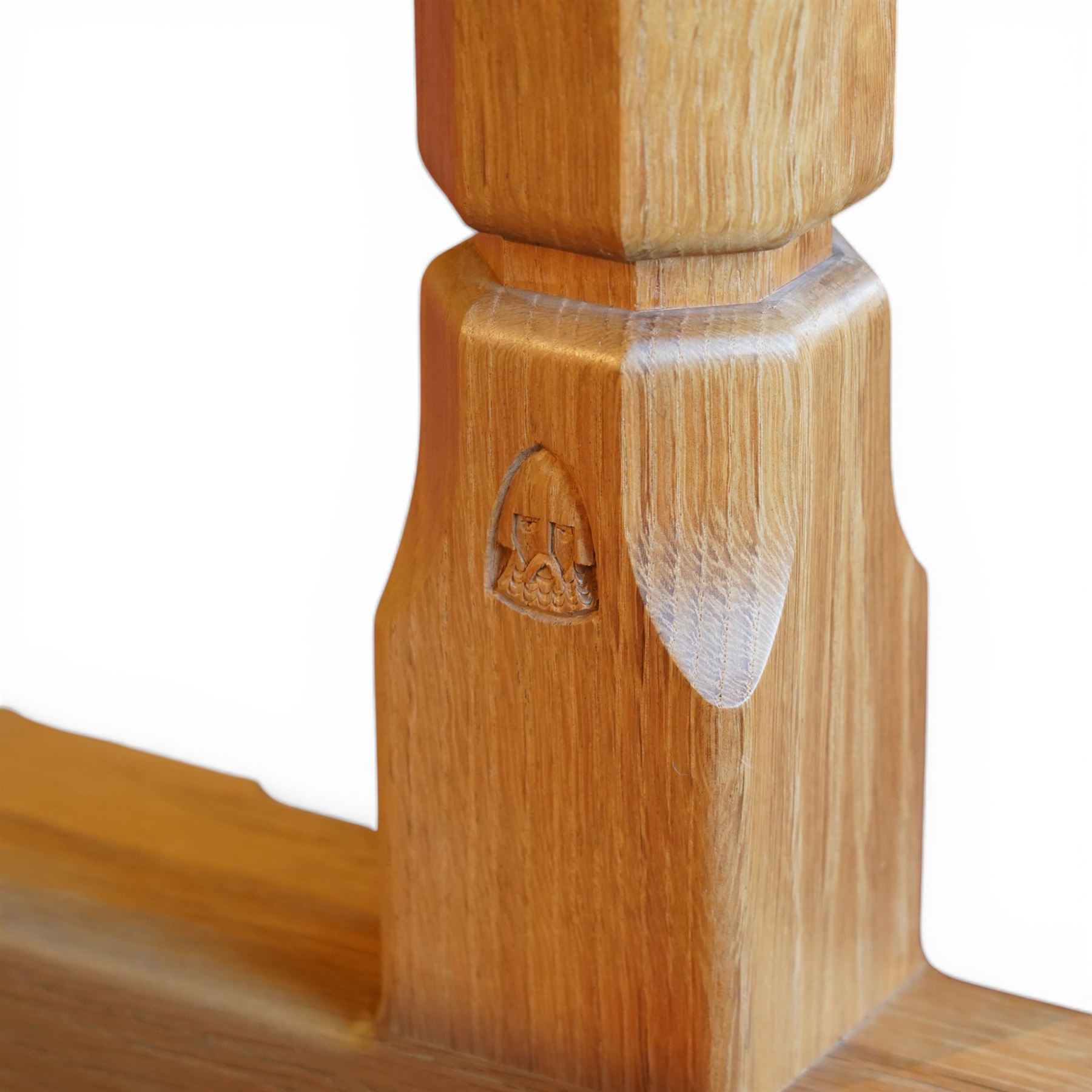 Knightman - oak rectangular refectory four pillar dining table, rectangular plank top, over twin pillar supports to both ends, united by a single stretcher with sled feet, with carved knight signature, by Horace Knight of Thirsk