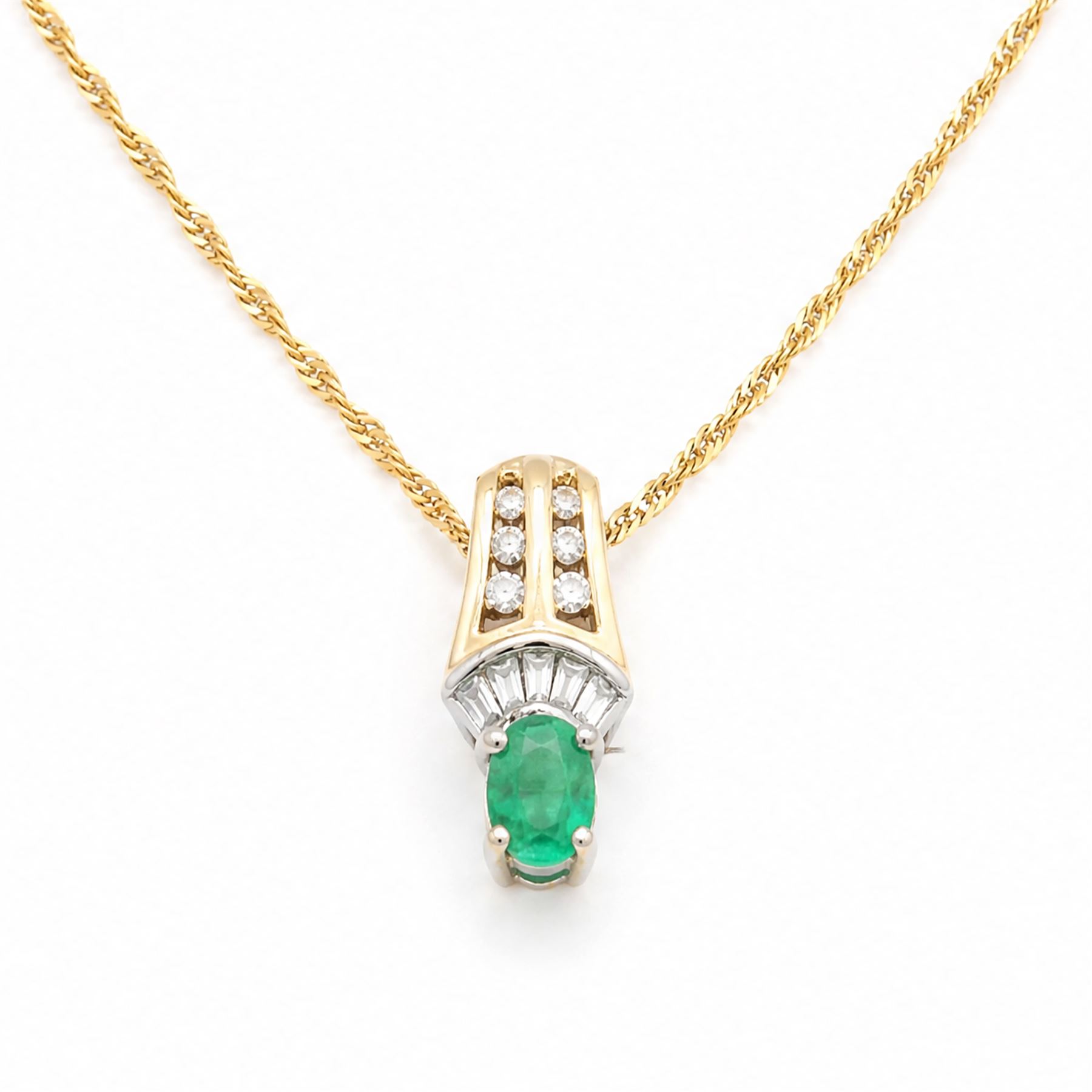 14ct white and yellow gold emerald and diamond pendant necklace, five tapered baguette cut diamonds and six round cut diamonds, suspending a single oval cut emerald of approx 0.45 carat, on a Singapore link chain necklace