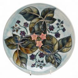 Moorcroft plates, to include the 1996 Year Plate limited edition number 106/500, with certificate, and two Brambles pattern plates, each with impressed and painted marks to base, D22cm (3)