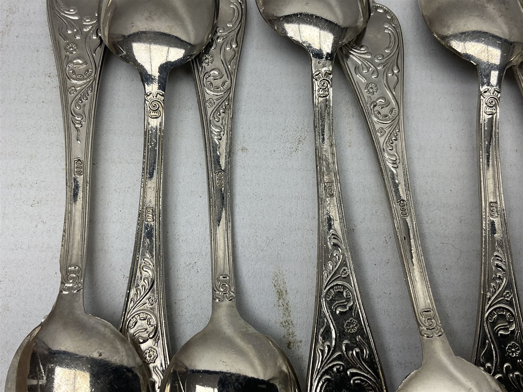 White metal flatware, comprising three table spoons, and ten teaspoons, marked 800, approximate weight 289 grams