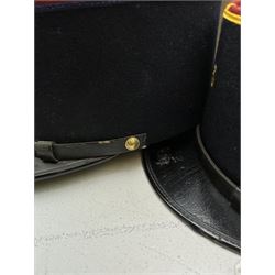 Three French Foreign Legion Kepis; two infantry examples and the third Calvary, each with black peak, original leather sweatband and markers mark stamped inside 