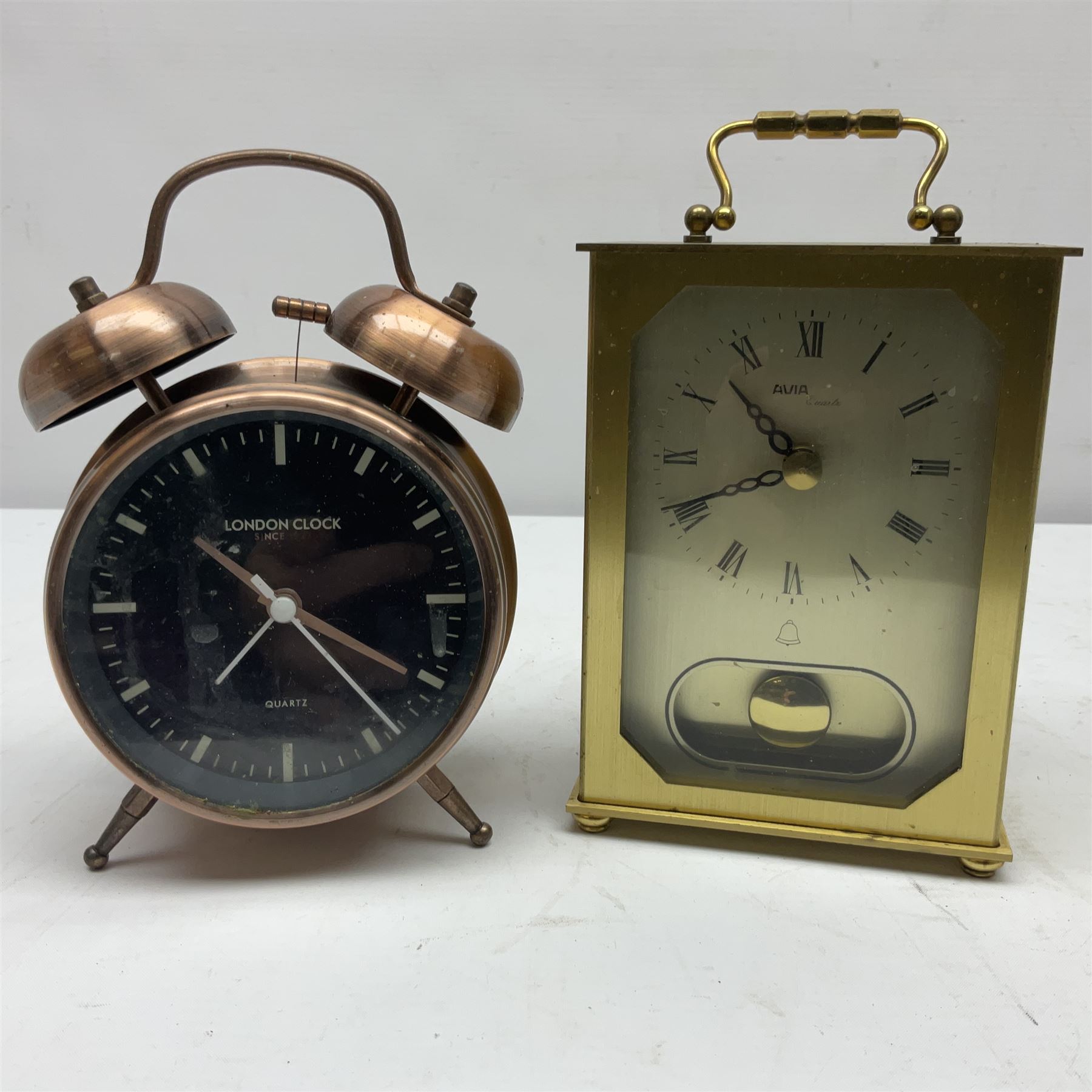 Avia Quartz mantle clock, a London alarm clock and a collection of coins