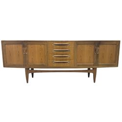 G-Plan – teak sideboard, four central drawers flanked by two double cupboards, enclosed by panelled doors 