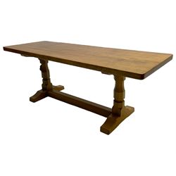 Mouseman - oak coffee table, rectangular adzed top on twin octagonal pillar supports, sledge feet united by floor stretcher, carved with mouse signature, by the workshop of Robert Thompson, Kilburn 