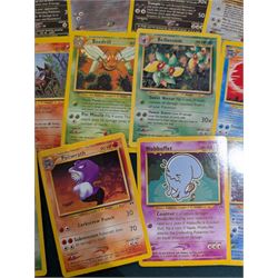 Collection of Pokemon TGC trading cards, including two WB First Movie Black Star promo cards Pikachu no. 4 and Dragonite no. 5, two Ancient Mew Black Star holo promo cards, Gym Challenge Giovanni's Persian 8/132 holo and a small collection WOTC, Neo Discovery and Neo Genesis cards, together with thirty four Bandai Carddass Pokemon cards, including prism Charizard no. 186 and Pokemon Topps cards including holo examples 