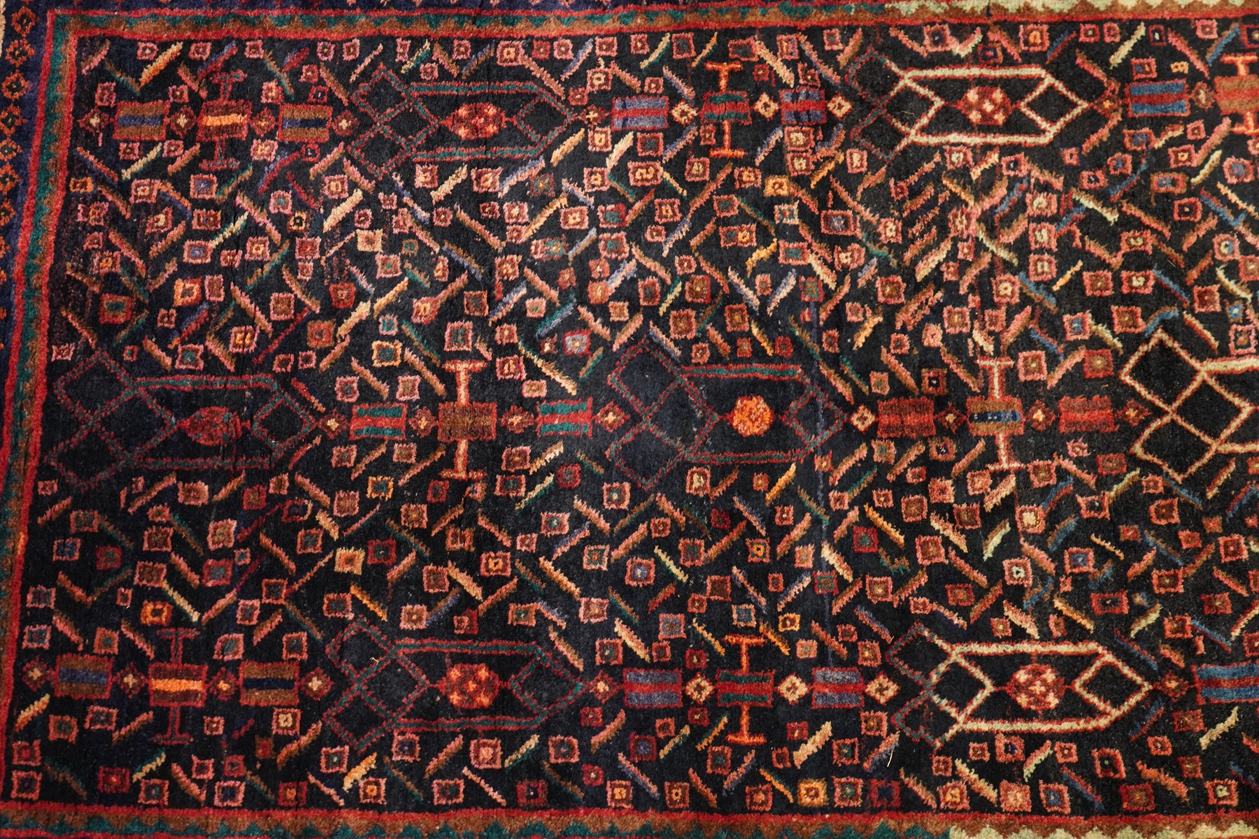 Large Persian indigo ground Herati runner rug, the busy field decorated with repeating geometric and Herati motifs in contrasting tones, enclosed by multiple guard stripes