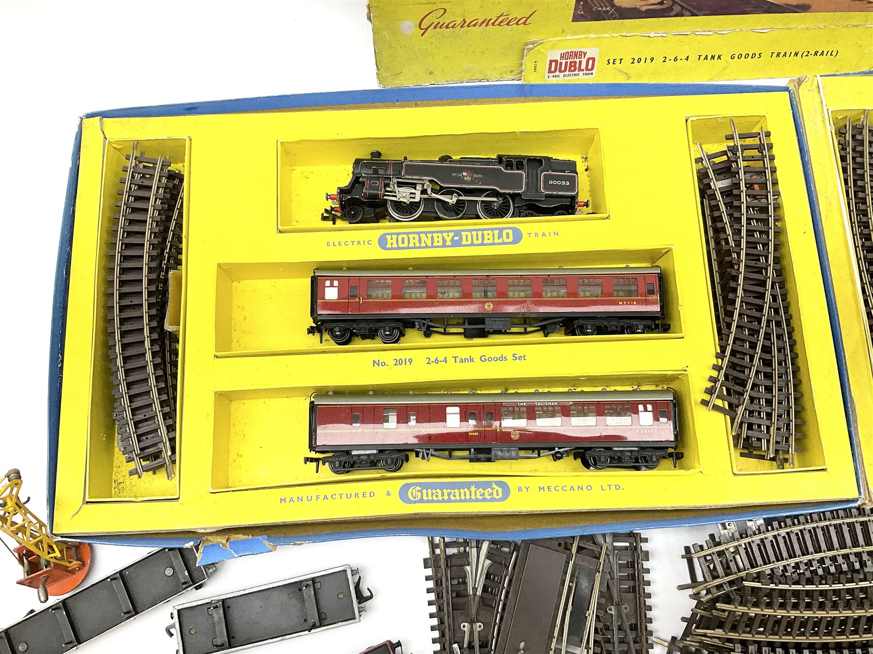 Hornby Dublo - two-rail 2022 'The Caledonian' Passenger Set LMR with Duchess Class 4-6-2 locomotive 'City of London' No.46245 with tender, two coaches and track, box base only, no lid; 4MT Standard 2-6-4 Tank locomotive No.80033 with two Talisman coaches and track in 2019 Goods Train Set box; four unboxed wagons, quantity of track, crane and buffer stops.