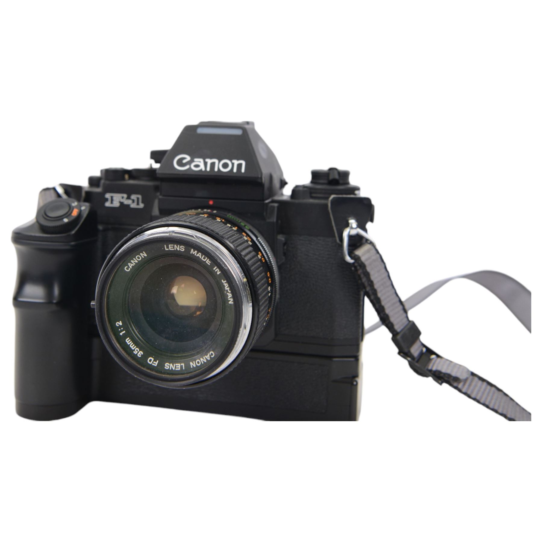 Canon F1 camera body, serial no. 223511, with 'Canon FD 35mm 1:2 FD' lens, serial no.23164, shoulder strap and Canon AE Power winder, serial no.174705