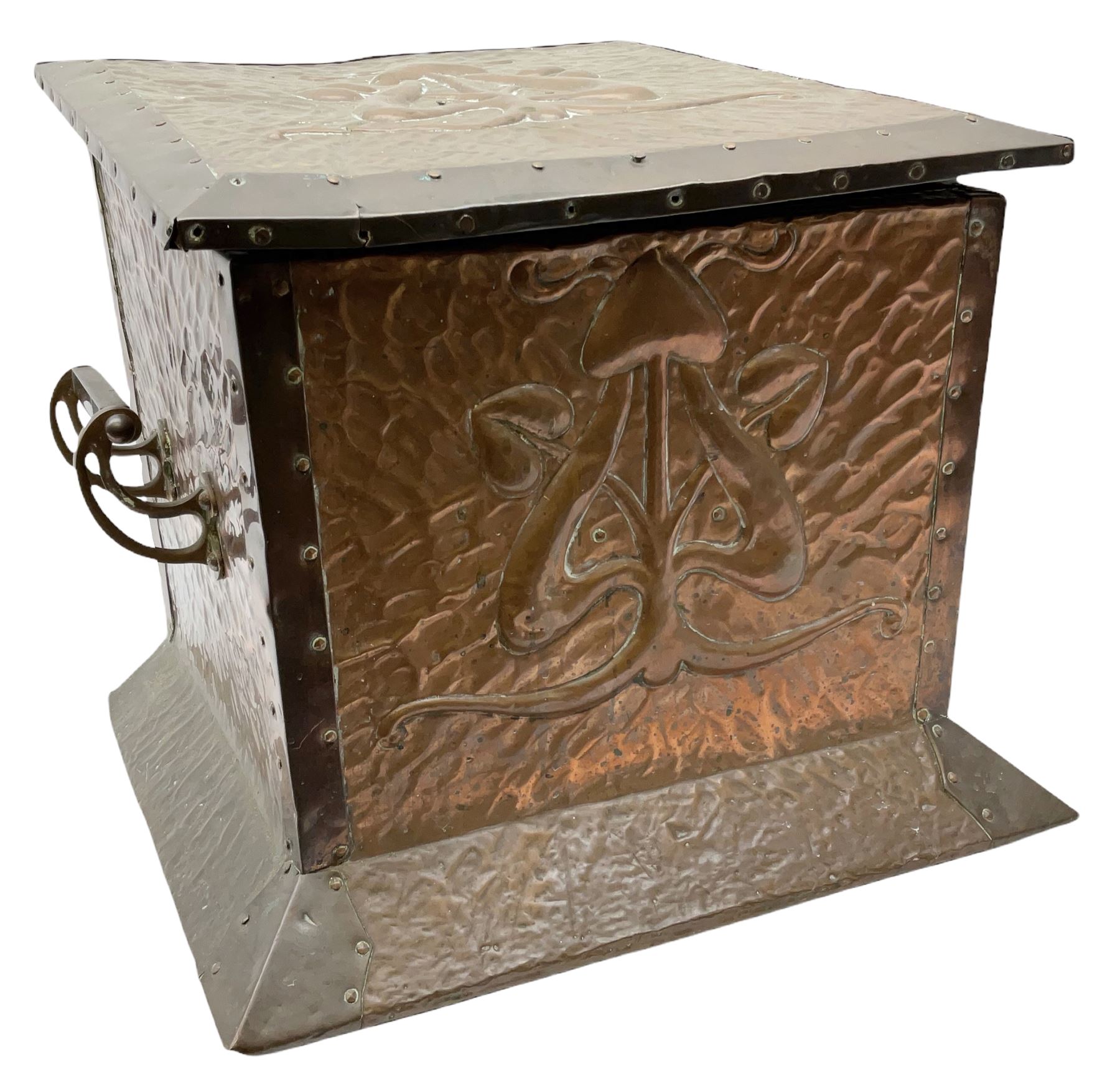 Arts and Crafts copper coal box, of square form with twin curved handles, with hammered finish, and embossed stylised motif to the front and hinged cover, H37cm L40cm D35.5cm