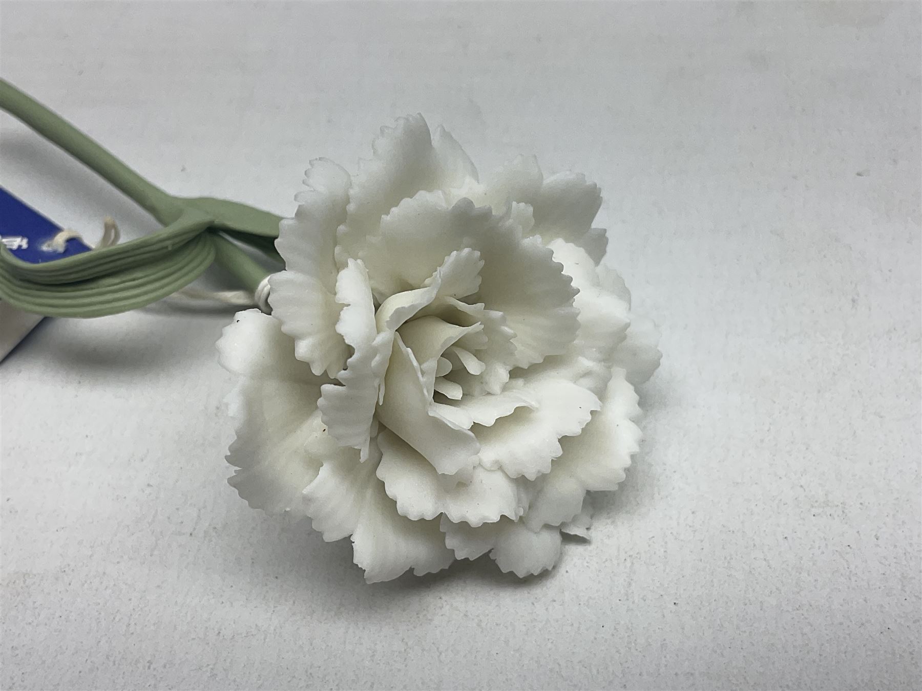 Seven Lladro flowers, comprising Japanese Camelia on base no 5181, Yellow Begonia on base no 5186, Miniature Begonia on base no 5188, Chrysanthemum on base no 5189, California Poppy no 5190.B, Miniature Begonia 5188.B and White Carnation no 5184.B, together with Lladro Spanish Joining pack with 17616 Winter Bell, Additional Lladro parasols and flowers etc 