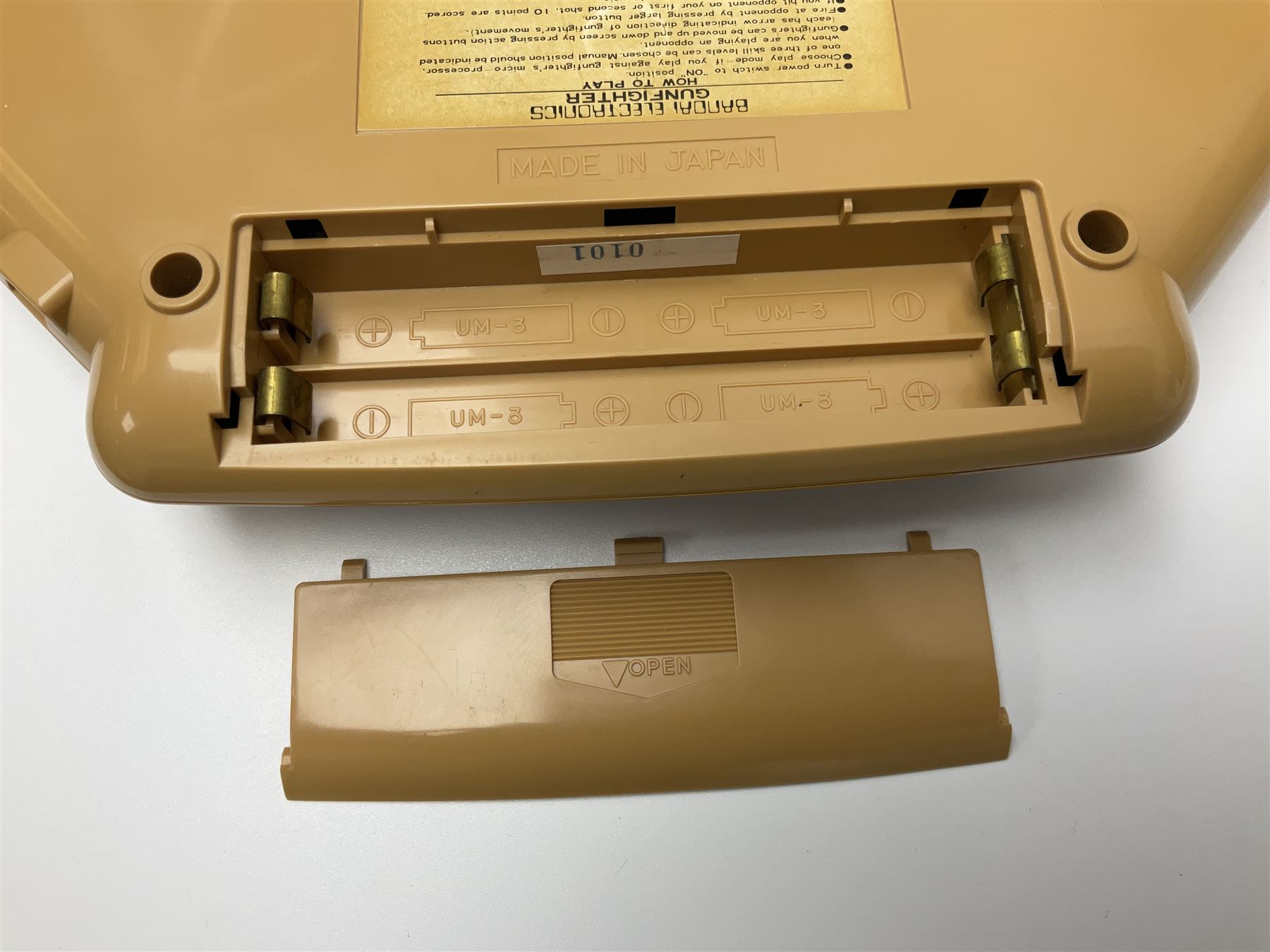 Three late 70s/early 80s handheld electronic games; Bandai Electronics Arcade ‘Gunfighter’ (1980), Grandstand ‘Invader From Space’ (1980), Palitoy ‘Merlin The Electronic Game Machine’ (1979) with game sheet and instruction booklet, all with original boxes (3) 