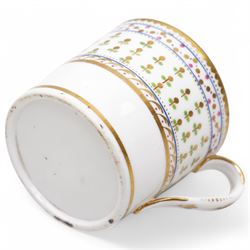 Pinxton porcelain trio, pattern no.193, comprising coffee can, teacup and saucer, decorated with green and gilt stylised sprigs and red and gilt dot borders, teacup with painted marks to base (3)