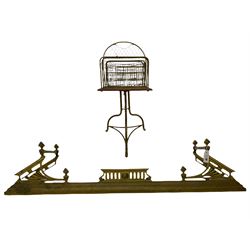 Early 20th century oak and brass magazine stand, swivel top with four divisions on shaped brass supports (W41cm), and a brass fire fender (W137cm)