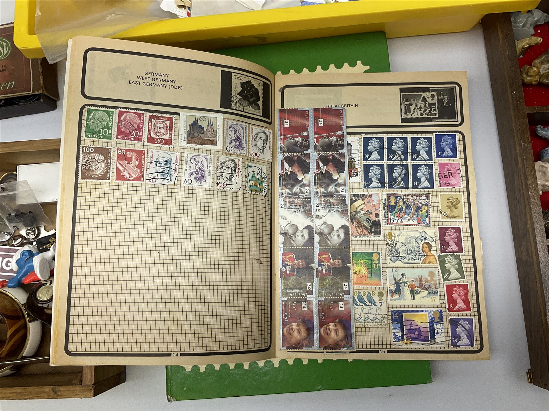 Collection of whimsy figures in a wooden display case, together with other assorted collectables, including stamps, pin badges etc