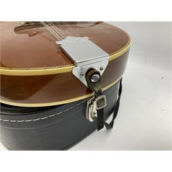 Palmer eight-string mandolin with mahogany back, simulated ivory and mother-of-pearl mounts L67cm; and Mahalo mahogany cased baritone scale ukulele, model no.U320B, L76cm; in hard carrying case (2)