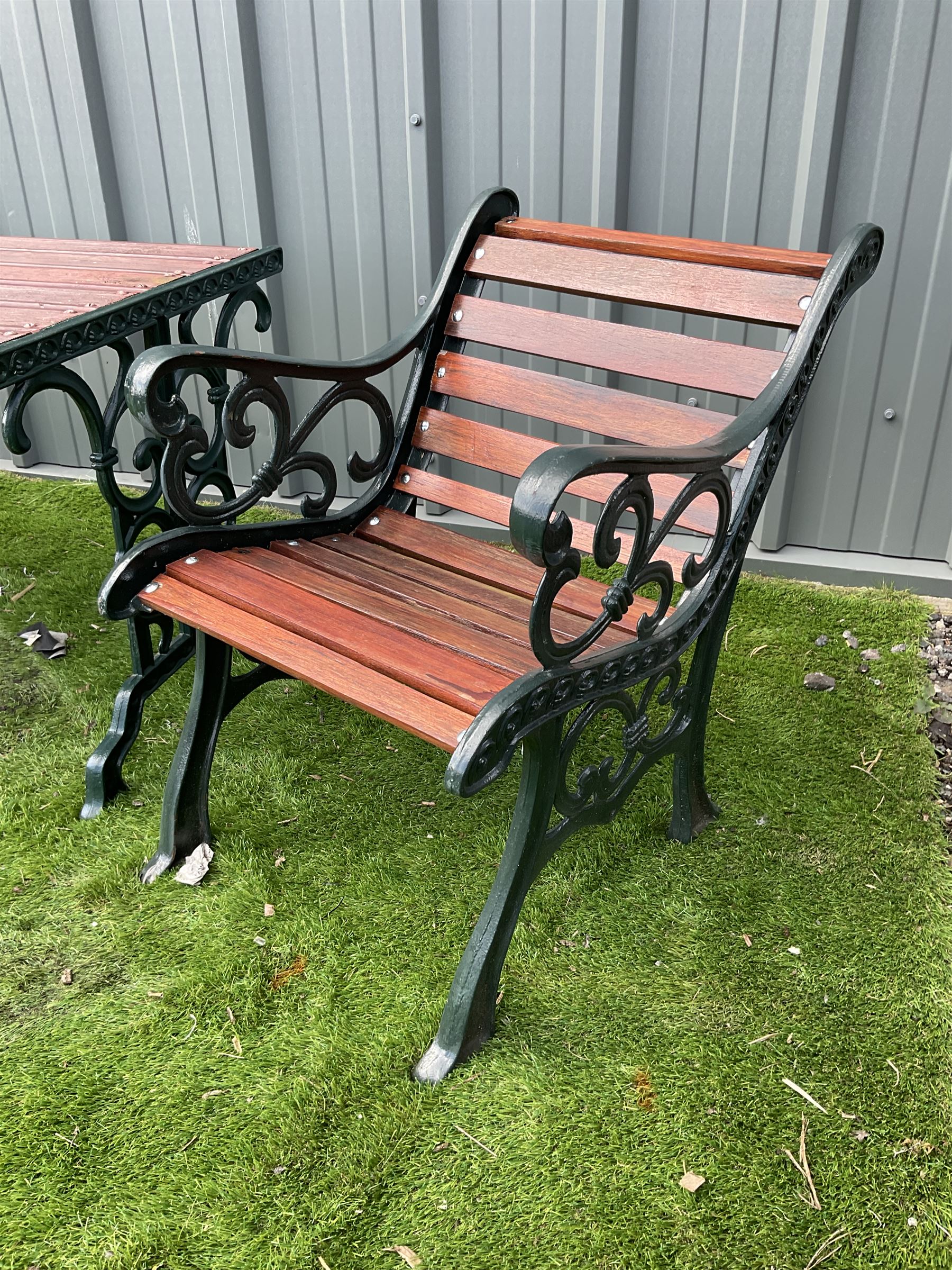 Painted cast iron and wood slated table and two chairs  - THIS LOT IS TO BE COLLECTED BY APPOINTMENT FROM DUGGLEBY STORAGE, GREAT HILL, EASTFIELD, SCARBOROUGH, YO11 3TX
