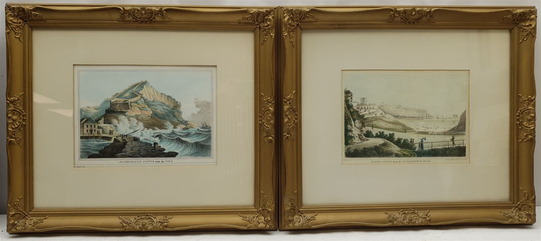 After J Stubbs (British 19th century): 'Scarborough Castle from the Pier' and 'Scarborough from the Bridlington Road', pair 20th century lithographs 20cm x 27cm; After Featherstone Robson: 'York Minster and Bootham Bar', colour print 23cm x 16cm (3)