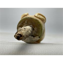 19th century carved ivory walking cane handle, modelled as the head of a greyhound with inset glass eyes, together with a further 19th century ivory example, modelled as a caricature of a gentleman's head, (2)