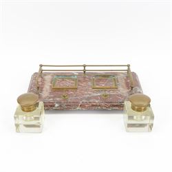Victorian brass metal mounted red marble inkstand, the stepped rectangular base raised upon bun feet, complete with two glass ink bottles with hinged lids, H12cm