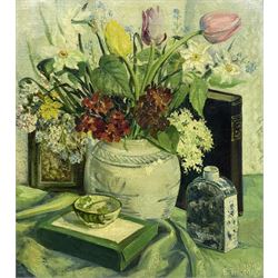 Elizabeth E Thomas (British exh.1923-1945): Still Life of Spring Flowers, oil on canvas signed and dated 1945, artist's address 'Barn Mead, Rectory Rd., Hawkwell, Hockley, Essex' verso 45cm x 40cm