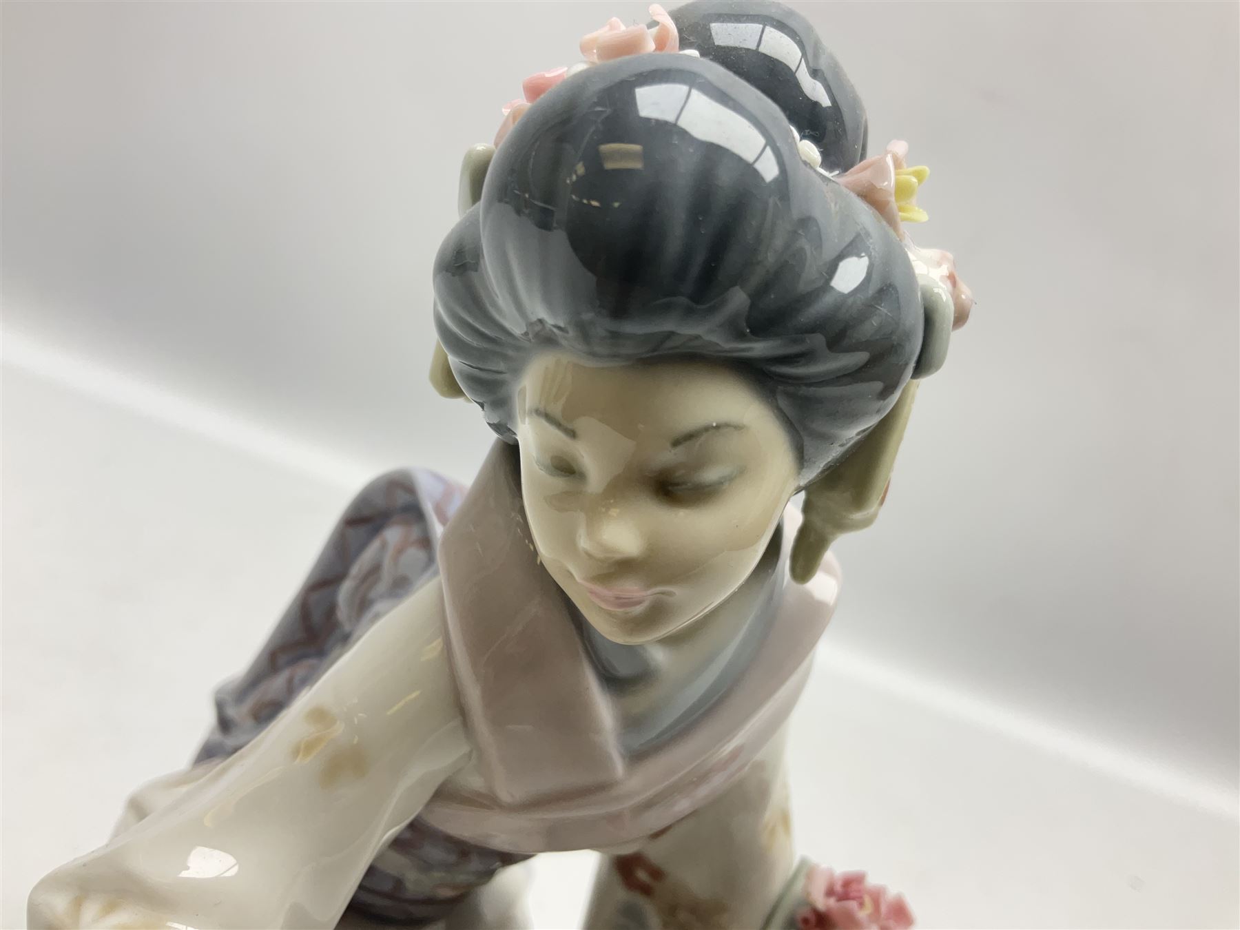 Two Lladro Japanese Ladies figures, comprising Kiyoko no 1450 and Yuki no 1448, both issued 1983, retired 1998, largest example H20cm