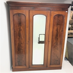 Victorian mahogany triple wardrobe, projecting cornice above single mirrored door flanked by two others enclosing fitted interior, plinth base, W180cm, H210cm, D61cm