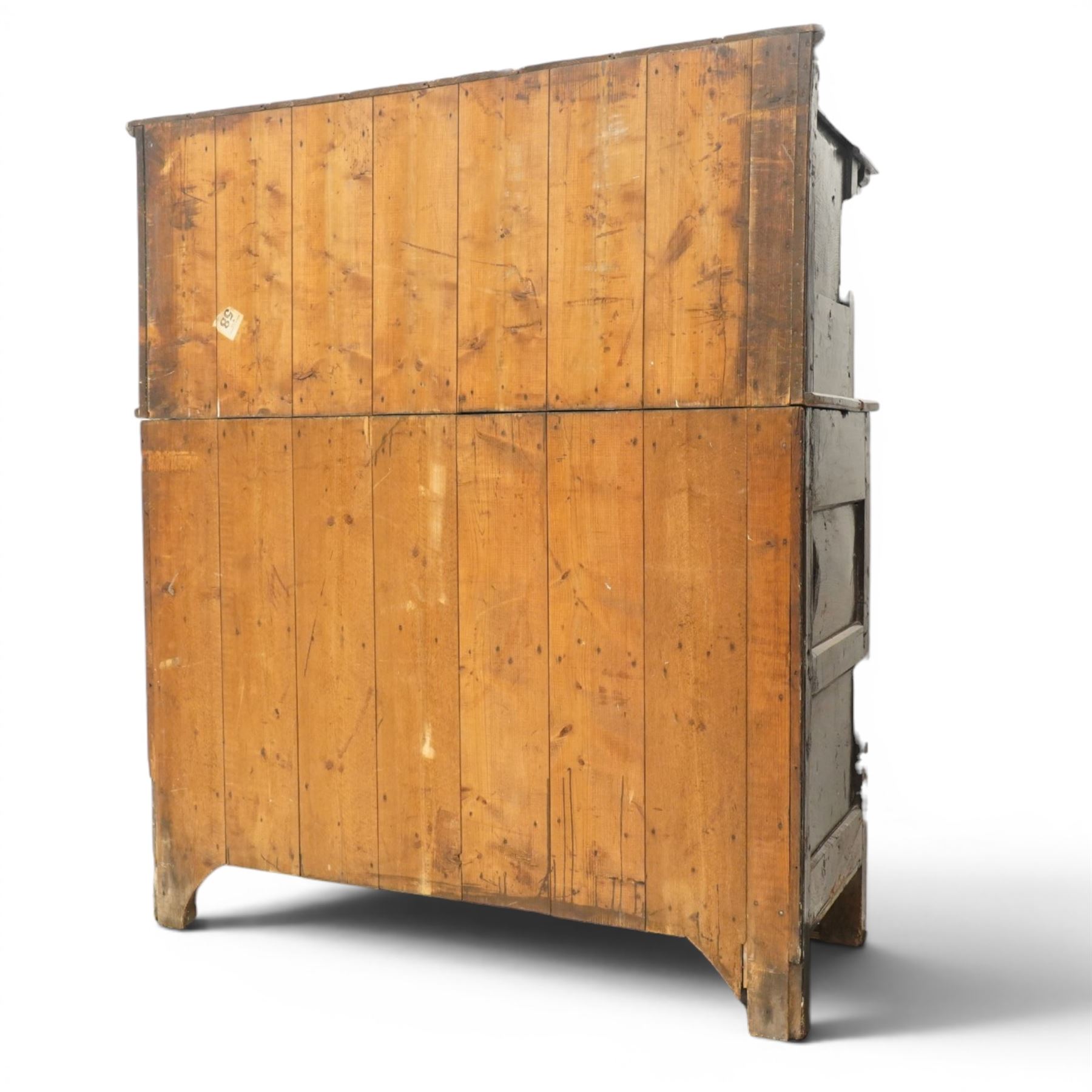 Early 18th century oak court cupboard, the projecting cornice carved with initials 'WKIW' and dated 1718 with turned terminals, fitted with two recessed panelled cupboard doors, large cupboard to base, raised on stile supports