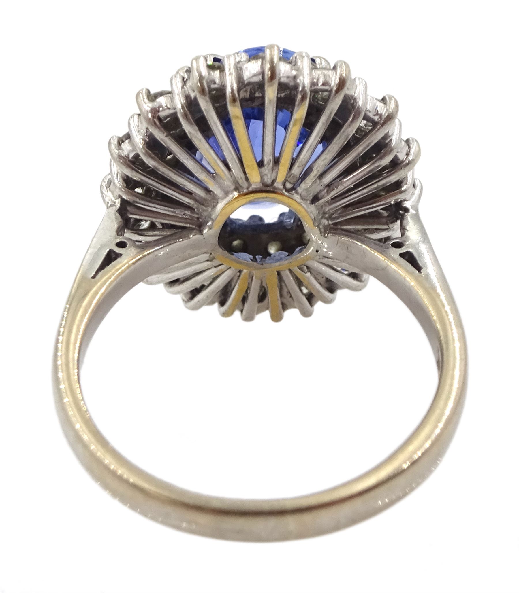 18ct white gold oval sapphire and round brilliant cut diamond cluster ring, Sheffield 2000, sapphire approx 3.75 carat, total diamond weight approx 0.70 carat