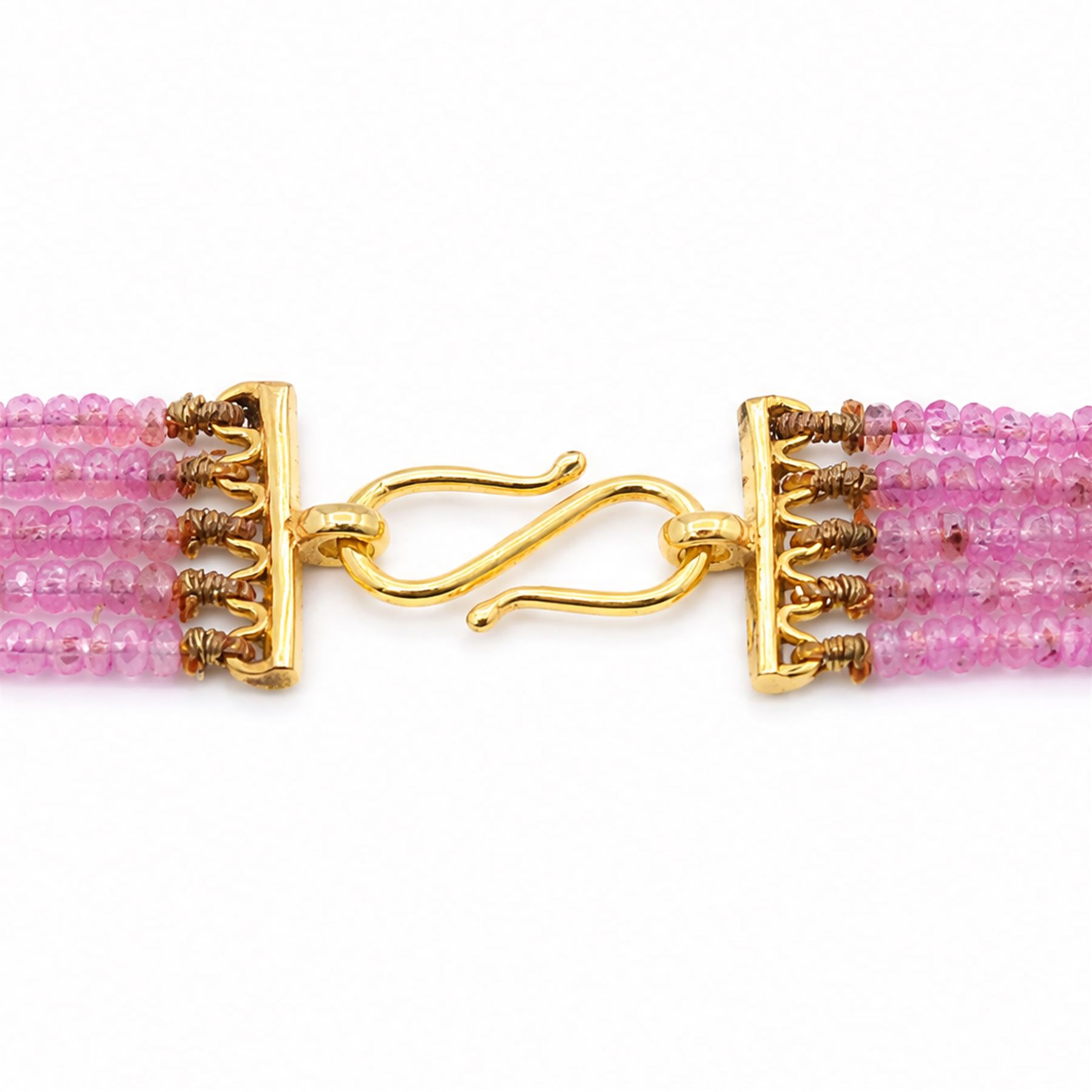 18ct gold pink sapphire necklace, five graduating stands of faceted pink sapphires, with an 18ct gold clasp, London 2004