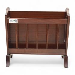 20th century mahogany magazine rack, with shaped ends and pierced divider slats, brass lion mask ring handles to each side, raised on splayed bracket feet