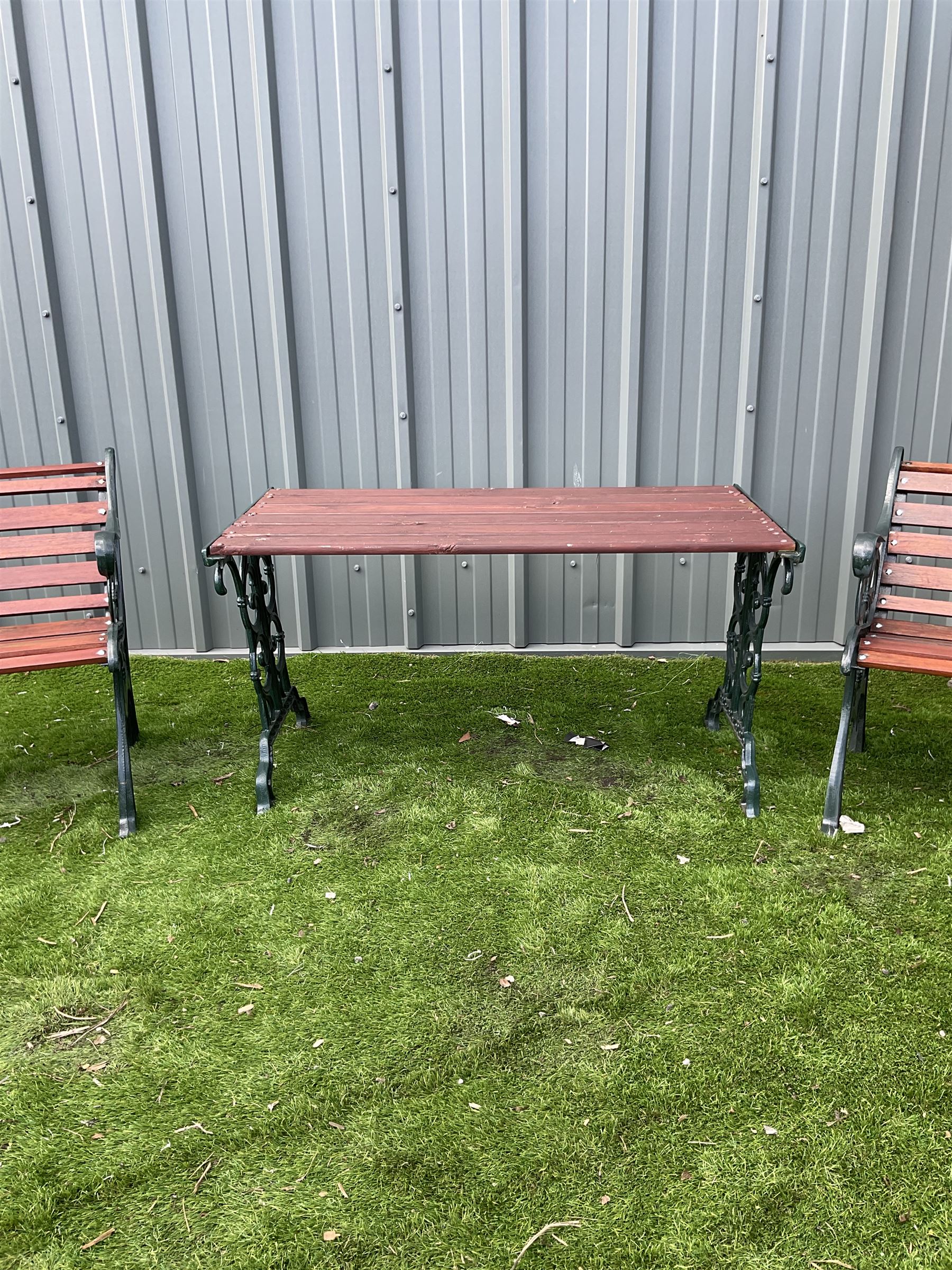 Painted cast iron and wood slated table and two chairs  - THIS LOT IS TO BE COLLECTED BY APPOINTMENT FROM DUGGLEBY STORAGE, GREAT HILL, EASTFIELD, SCARBOROUGH, YO11 3TX