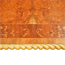 Arthur Brett & Sons - late 20th century twin pedestal dining table in the Second Empire style, the oval Amboyna burl veneered top, bordered with tulipwood crossbanding and delicate floral marquetry inlay, and rosewood crossbanded outer border within gilt gadrooned edge, over two mahogany triform pedestal bases with rosewood crossbanding and decorated with neoclassical marquetry of tied ribbons, leafy sprays, and scrolling acanthus decoration, raised on carved and gilded lion paw terminals on plinth bases, underside with maker's label