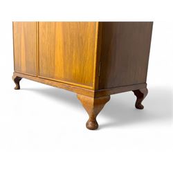 Ashton Leach & Cumberbirch Ltd., Rochdale - early 20th century walnut and mahogany gentleman's wardrobe, arched moulded top with book-matched figured walnut veneers, double doors enclosing fitted interior with hanging rail, tie rack and drawers, raised on cabriole supports