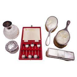 1920s silver mounted dressing table set, comprising two hair brushes and a clothes brush, each inset with mother of pearl, and engraved with initials to silver, hallmarked George Betjemann & Sons, London 1922, together with an early 20th century silver and tortoiseshell mounted cut glass scent bottle, with spherical fluted glass body, the silver and tortoiseshell hinged cover opening to reveal an internal glass stopper, hallmarked Walker & Hall, Birmingham 1915, 1930s silver lidded circular glass jar, the silver cover embossed and the glass etched with sunflowers, hallmarked W J Myatt & Co, Birmingham 1932 and a set of six modern coffee bean spoons, hallmarked Cooper Brothers & Sons Ltd, Sheffield 1972, in original fitted case
