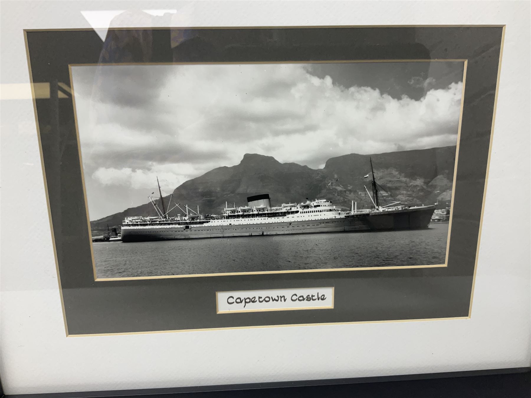 Set of twelve monochrome photographs of mid-20th century merchant vessels comprising general cargo ships, cargo liners, RMMV passenger cargo liners and hospital ship including Rowallan Castle, Drakensberg Castle, Stirling Castle, Capetown Castle, Pachumba, Tilapa etc; average size 18 x 24cm; uniformly mounted in black frames (12)