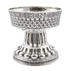 Silver Tudor Style pedestal bowl embossed, hammered and scaled decoration with inscription ‘Benedictus Deus Im Dona Suis Ame’ (Blessed be God for his gifts. Amen) by S Blanckensee & Son Ltd Birmingham 1922, approx 10.5oz, H11cm