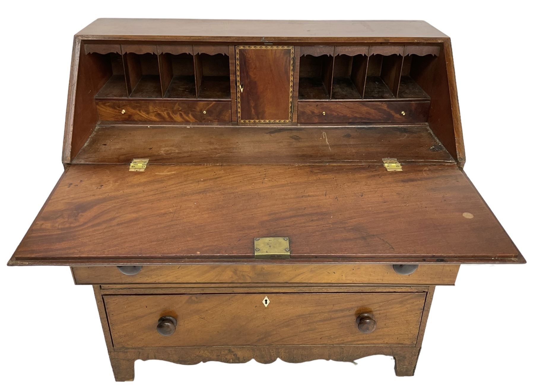 George III mahogany bureau, the fall front enclosing interior fitted with pigeon holes, drawers and cupboard, three graduating drawers below, with ivory escutcheons, shaped apron on bracket feet 

This item has been registered for sale under Section 10 of the APHA Ivory Act
