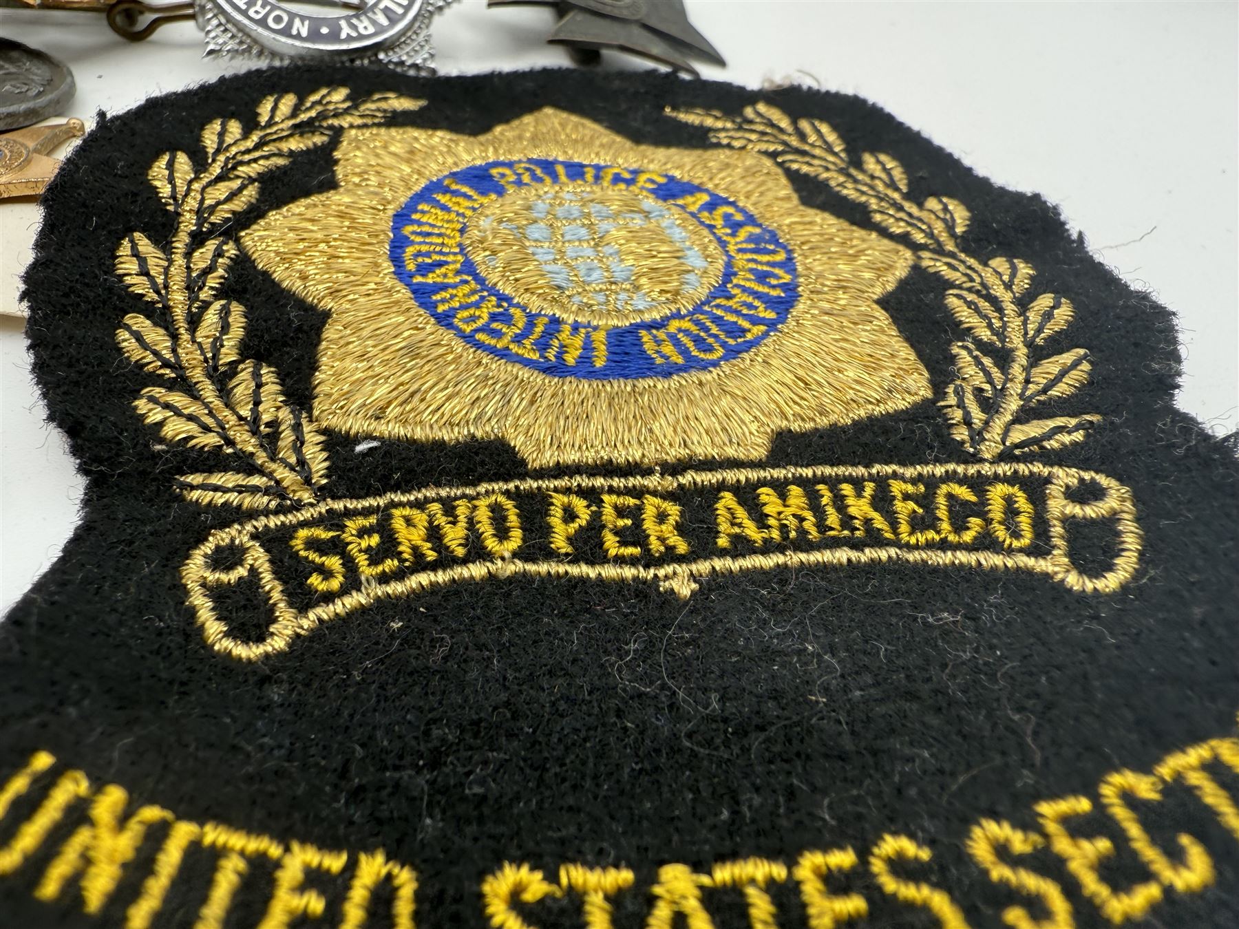 Collection of military and similar enamel badges, pin badges, cloth badges and brasses