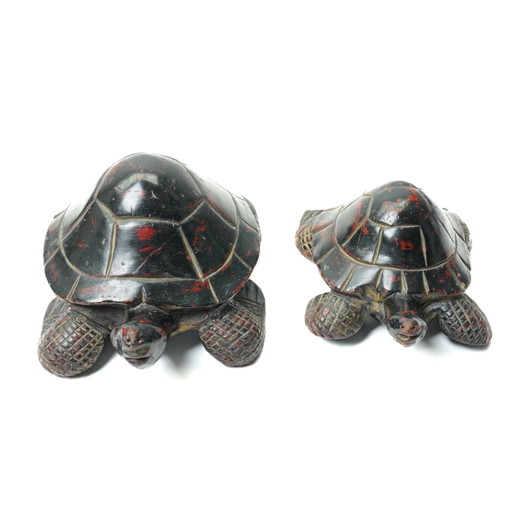 Set of four Asian carved and lacquered graduated ornamental turtles, largest L30cm