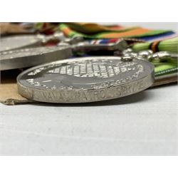 WW2 Royal Naval group of eight medals comprising OBE, hallmarked silver Distinguished Service Cross inscribed verso Lieut. J.R. McCluskie RNVR 1945, 1939-1945 Star, Atlantic Star, Africa Star, 1939-1945 War Medal, Defence Medal and Royal Naval Patrol Service Medal inscribed Lieutenant J.R. McCluskie Royal Naval Patrol Service; with seven original photographs of a sea battle 27th November 1940 against the Italian Fleet and another photographic postcard of Sir Stafford Cripps arriving on board one of the vessels.