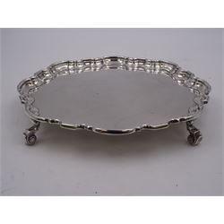 1930s silver waiter, of hexagonal form with pie crust rim, upon four scroll feet, hallmarked Manoah Rhodes & Sons Ltd, Sheffield 1936