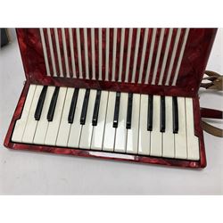 German Hohner student II compact accordion with 26 keys and 12 bass registers in a hard case With tutor