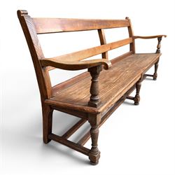 Early 20th century pine and oak bench seat, stained pine rail back frame with shaped oak arms