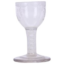 Three 18th century drinking glasses, the first example with rounded bowl engraved with foliate sprigs and border to rim, upon a short double series opaque twist stem and thick foot, H10cm the second with ogee part fluted bowl upon a short plain stem and thick stepped foot, H9cm, and the third toastmaster example with rounded funnel bowl upon a plain stem and thick firing foot, H11cm 