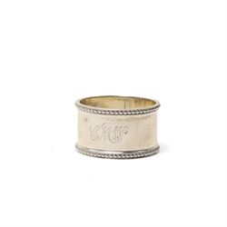 Silver circular ring box with hinged tortoiseshell cover, glass block inkwell with pique tortoiseshell cover Birmingham 1921 and a silver napkin ring (3)