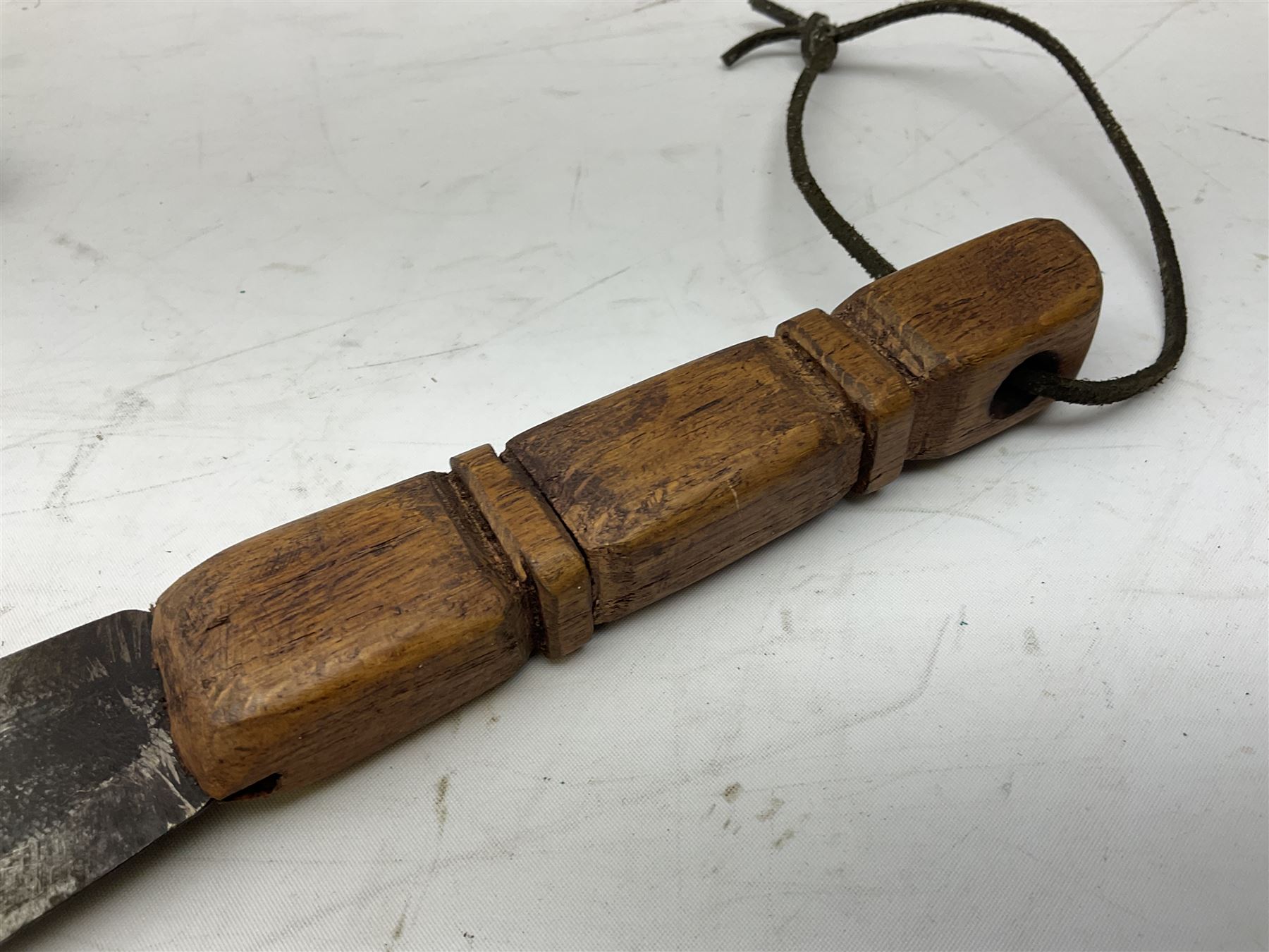 Near pair of African Moroccan Berber tribal Shula daggers each with engraved 39cm curving fullered steel blade, carved and inlaid horn grip and leather covered scabbard L57cm overall; kindjal style dagger with brass covered and jewelled grip and scabbard; another Eastern dagger with leather covered grip and scabbard; and a large Eastern knife with animal hide scabbard (5)