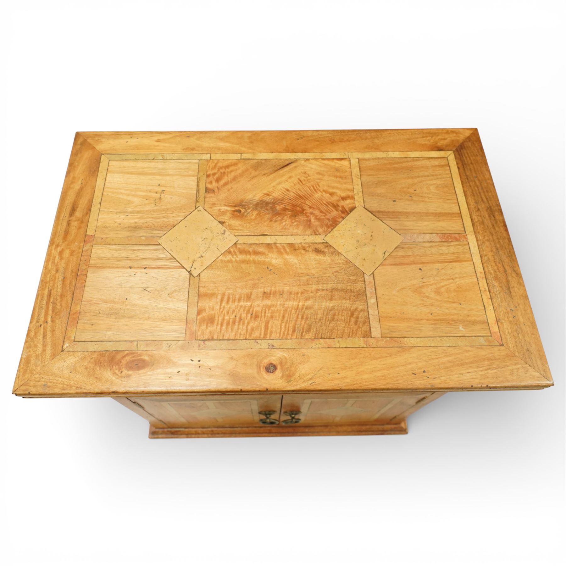 Barker & Stonehouse - ‘Flagstone’ inlaid mango wood television or media cabinet, rectangular moulded top with geometric inlaid panels, open central media shelf over a pair of panelled cupboard doors with inlay and metal ring handles, enclosing fixed shelving, raised on turned bun feet