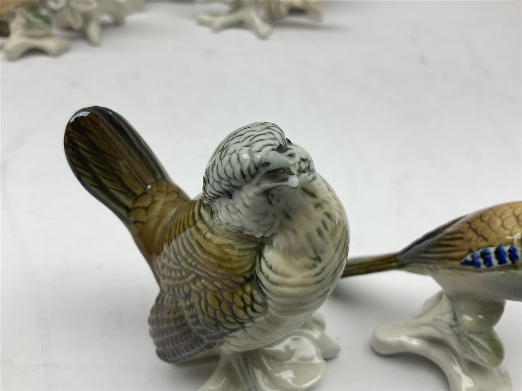 Eight Karl Ens bird figures, together with Mack blue tit and one other